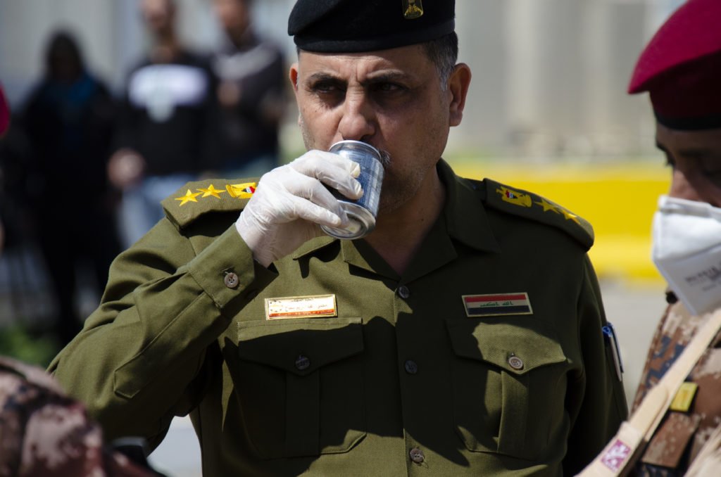 An Iraqi officer drinks a Rip It. Photo by Kevin Knodell/Coffee or Die.