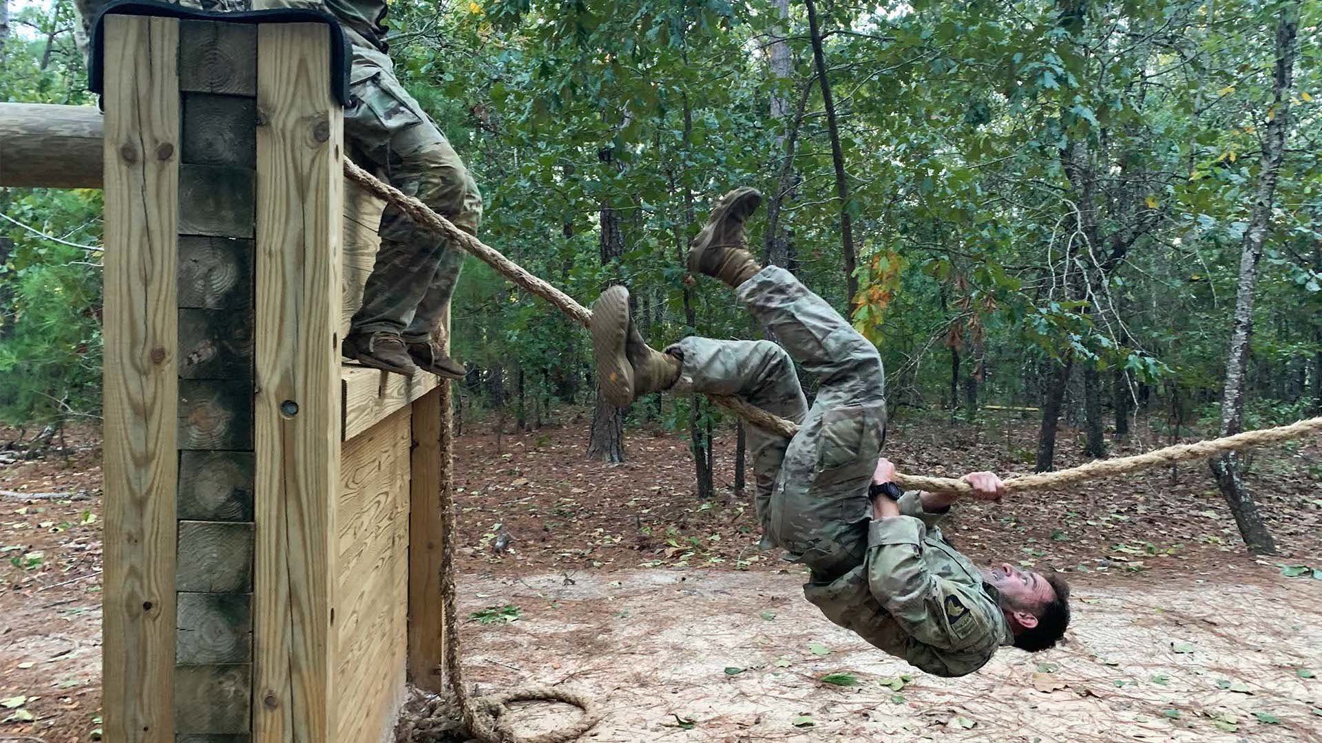 A soldier representing Forces command works his way through one of nine obstacles in the All American Mile obstacle course, on the last day of events at Fort Bragg, North Carolina for the Best Squad Competition, Oct. 5, 2022. Photo by Jenna Biter/Coffee or Die Magazine.