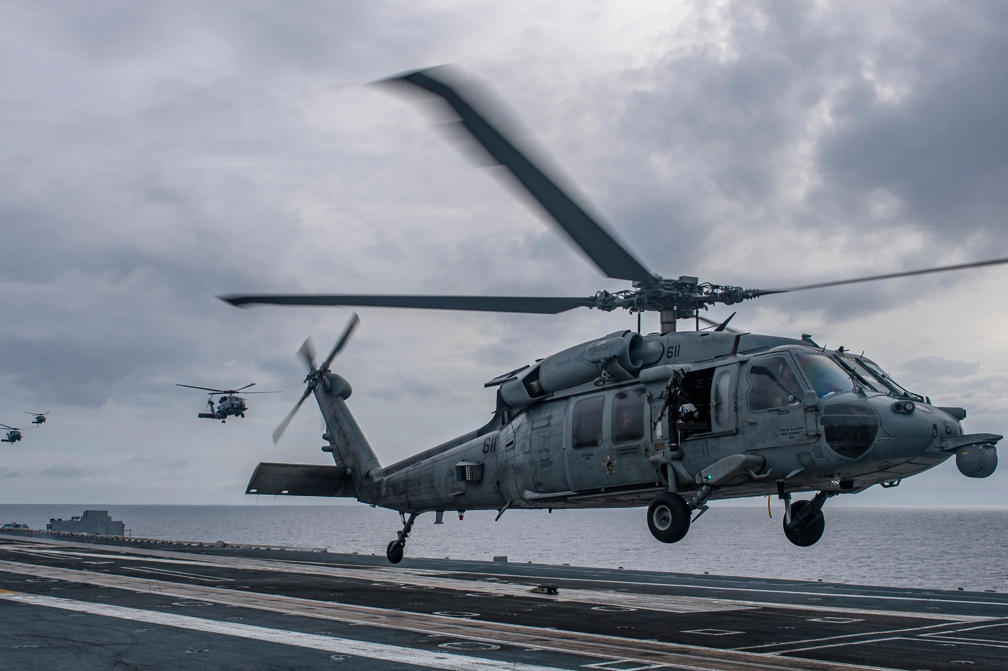 An MH-60S Sea Hawk helicopter lands aboard the aircraft carrier USS Nimitz in the South China Sea, Sunday, Feb. 12, 2023, as Nimitz in U.S. 7th Fleet was conducting operations. The 7th Fleet based in Japan said Sunday that the USS Nimitz aircraft carrier strike group and the 13th Marine Expeditionary Unit have been conducting “integrated expeditionary strike force operations” in the South China Sea. US Navy photo by Mass Communication Specialist 2nd Class Justin McTaggart via A.