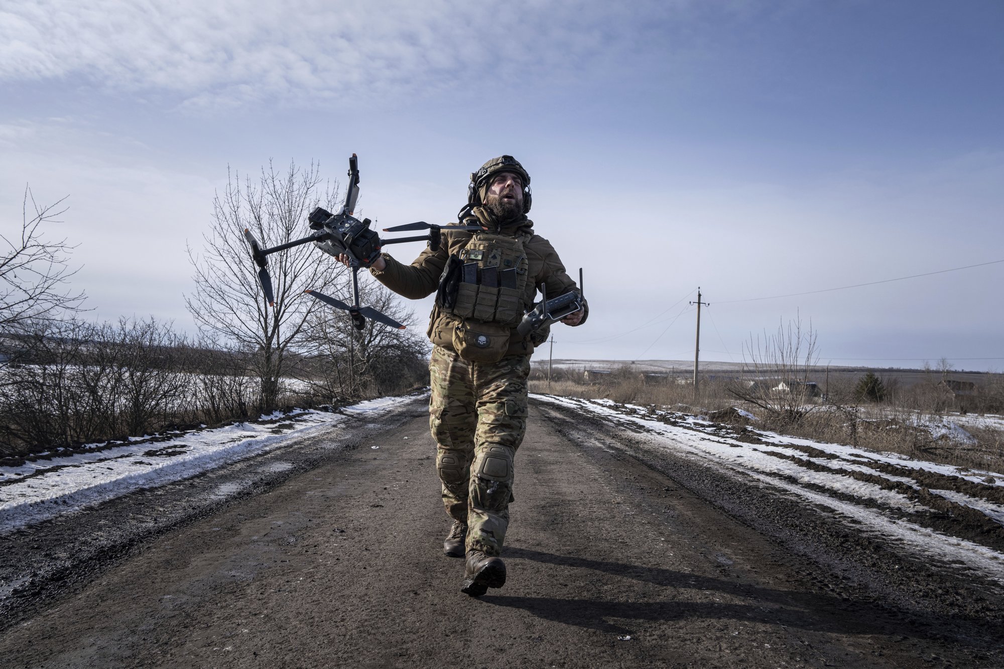 A Ukrainian serviceman aka Zakhar prepares to fly by a drone at the frontline in Donetsk region, Ukraine, Monday, Feb. 13, 2023. (AP Photo/Evgeniy Maloletka)