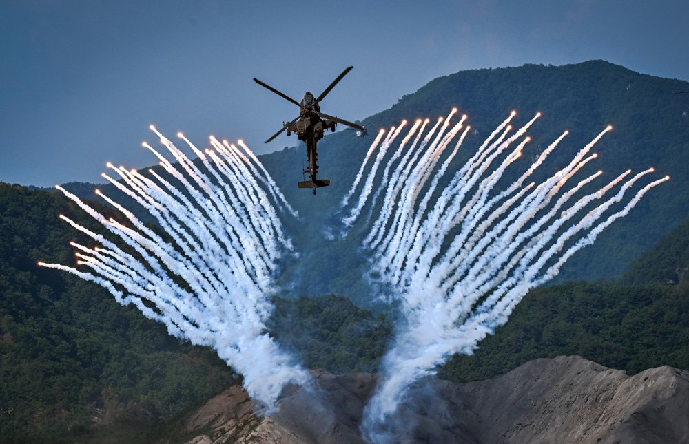 South Korea's Apache AH-64 helicopter fires flares during a South Korea-U.S. joint military drill.