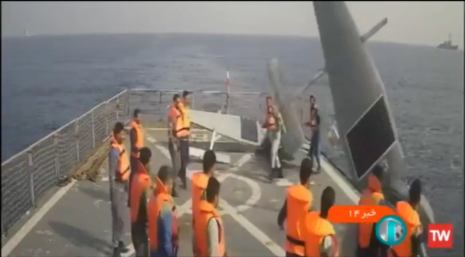 Iranian sailors throw back a US Navy Saildrone an American warship trails their vessel on Friday, Sept. 2, 2022. Iranian forces have grabbed three of the unmanned, wind-powered drones this week. Screenshot via Iranian state TV.