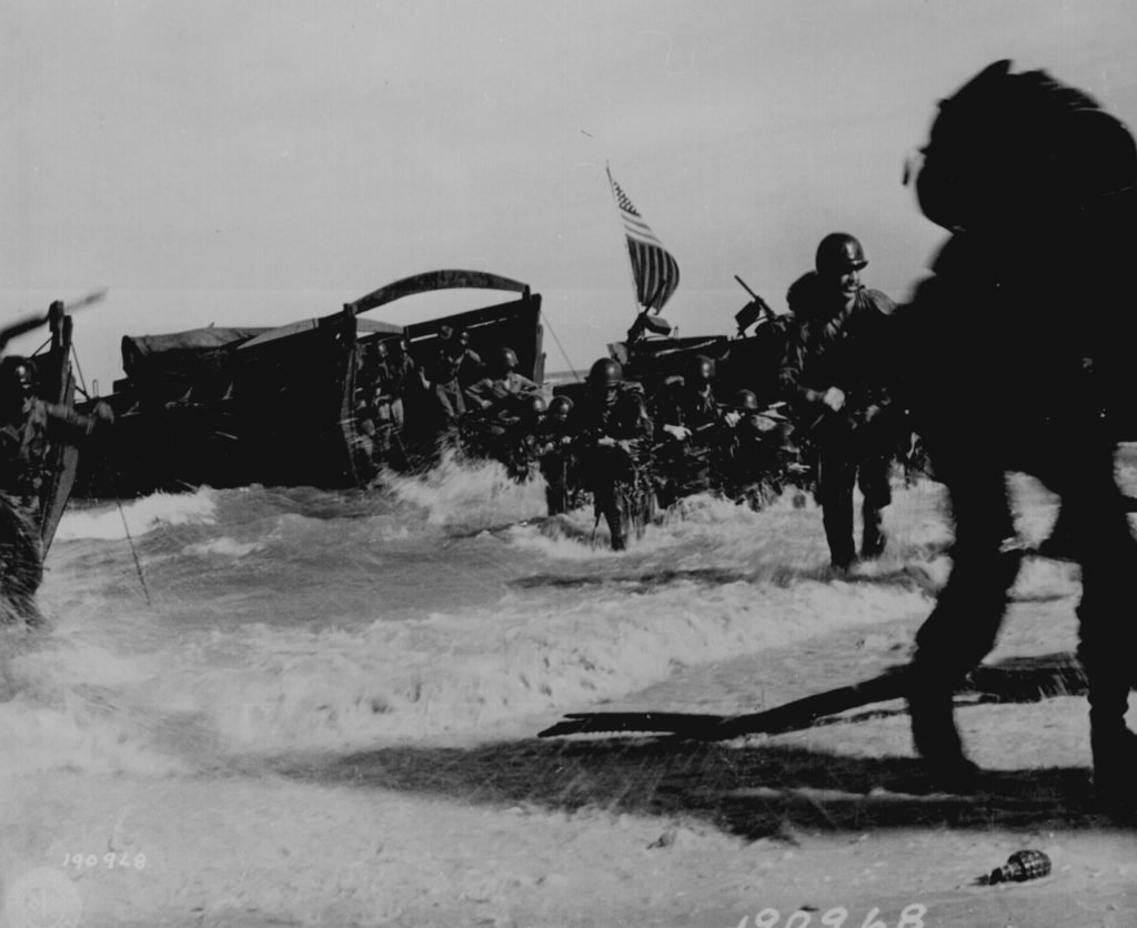 137. " American troops of the 163rd Infantry Regiment hit the beach from Higgins boats during the invasion of Wadke Island, Dutch New Guinea." Lt. Kent Rooks, May 18, 1944. 111-SC-190968. National Archives Identifier: 531192