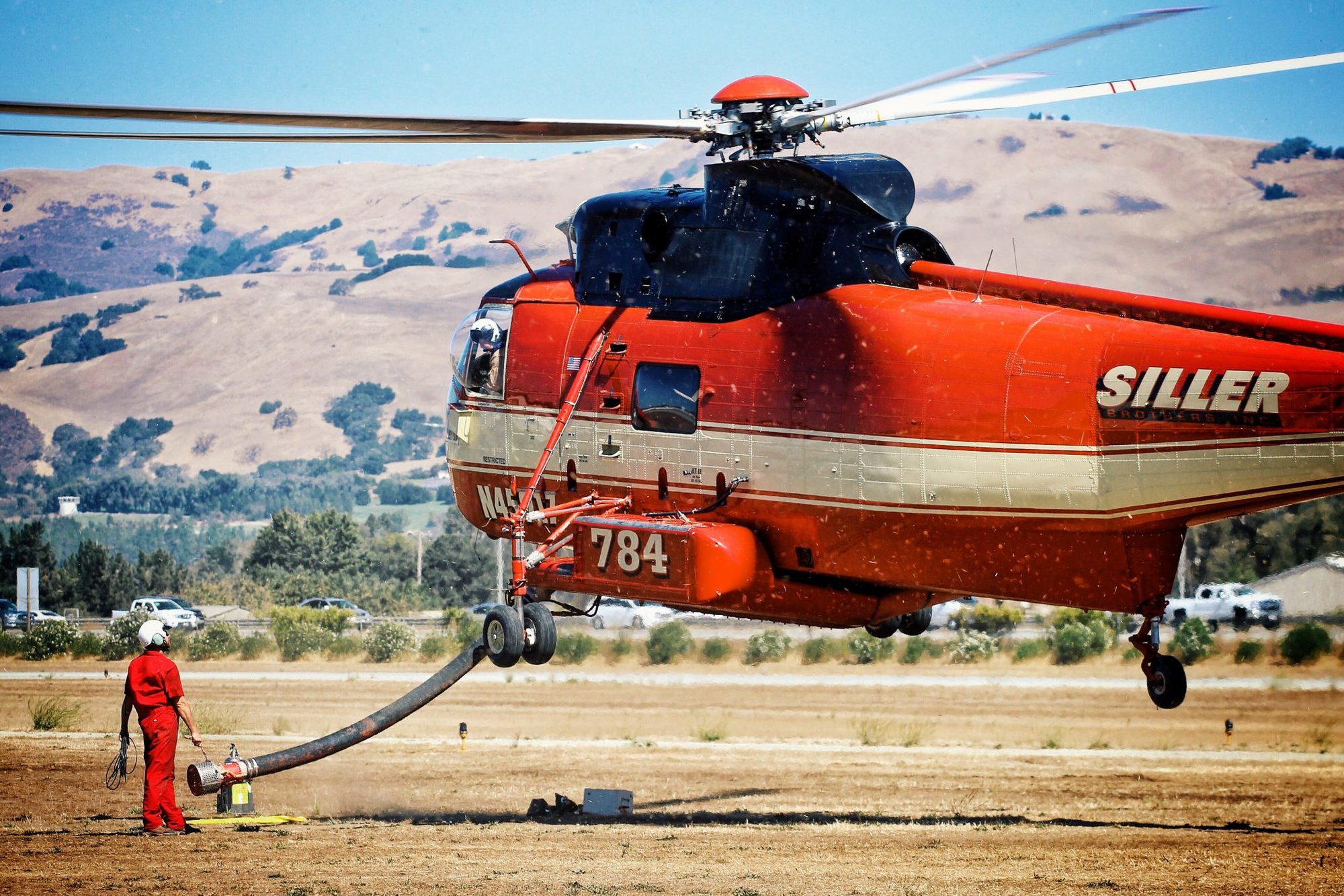 Firefighter helicopter hovering. Photo courtesy of Unsplash.