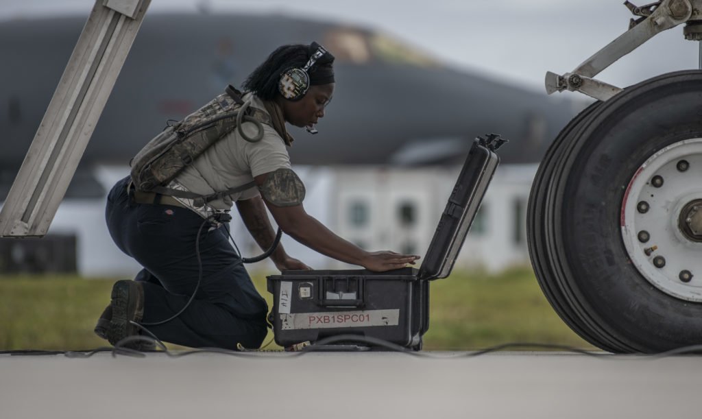 Senior Airman Raisa Ward, 9th Expeditionary Bomb Squadron Aircraft Maintenance Unit avionics technician, organizes a tool box at Andersen Air Force Base, Guam, May 5, 2020, after performing maintenance on a B-1B Lancer. Photo by Senior Airman River Bruce/U.S. Air Force. 