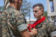 A Marine receives his blood stripe during a ceremony at Marine Corps Air Station Yuma, Ariz. The blood stripe, worn on the trouser seam of Marine dress blues, honors the blood shed by officers and noncommissioned officers during the Battle of Chapultepec. US Marine Corps photo by Cpl. Sabrina Candiaflores.