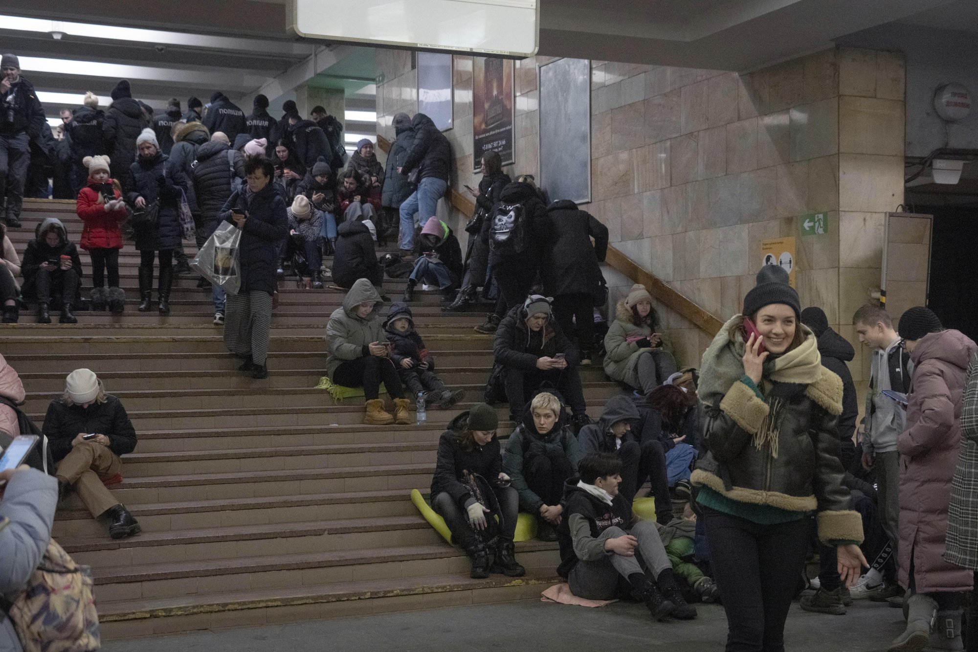 People gather in a subway station being used as a bomb shelter during a Russian rocket attack in Kyiv, Ukraine, Friday, Feb. 10, 2023. (AP Photo/Efrem Lukatsky)
