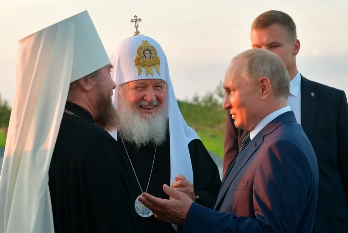 Vladimir Putin speaks to Russian Orthodox Church Patriarch Kirill (center) in Samolva, Russia, on Sept. 11, 2021. Alexei Druzhinin/Pool Photo via AP and The Conversation.