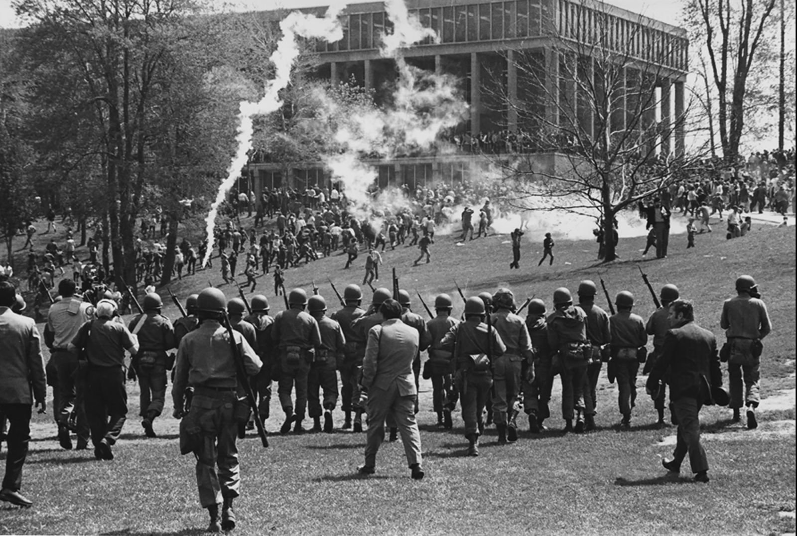 The Ohio National Guard is called in to disperse a rally scheduled for noon on May 4, 1970. Shortly after the protest begins, guardsmen fire tear gas at the students. Some students later said they were surprised the guardsmen followed them as they ran away from the tear gas. The guardsmen were clearly armed, but many students said they believed their weapons were not loaded with live ammunition.Kent State University News Service