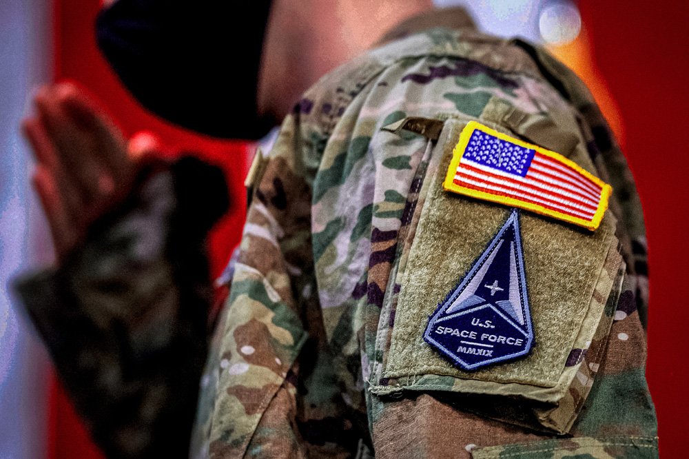 A solider wears a U.S. Space Force uniform during a ceremony for U.S. Air Force airmen transitioning to U.S. Space Force guardian designations at Travis Air Force Base.