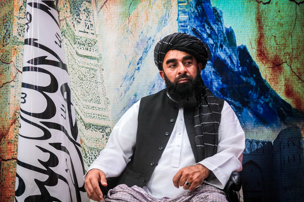 The Taliban's spokesman, Zabihullah Mujahid, sits during an interview.