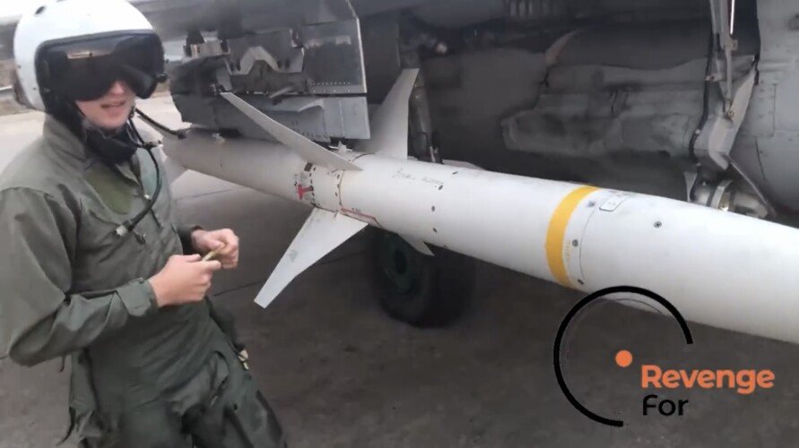 A Ukrainian pilots writes a message on a US-made, AGM-88 HARM anti-radiation missile. Photo courtesy RevengeFor via screen grab.