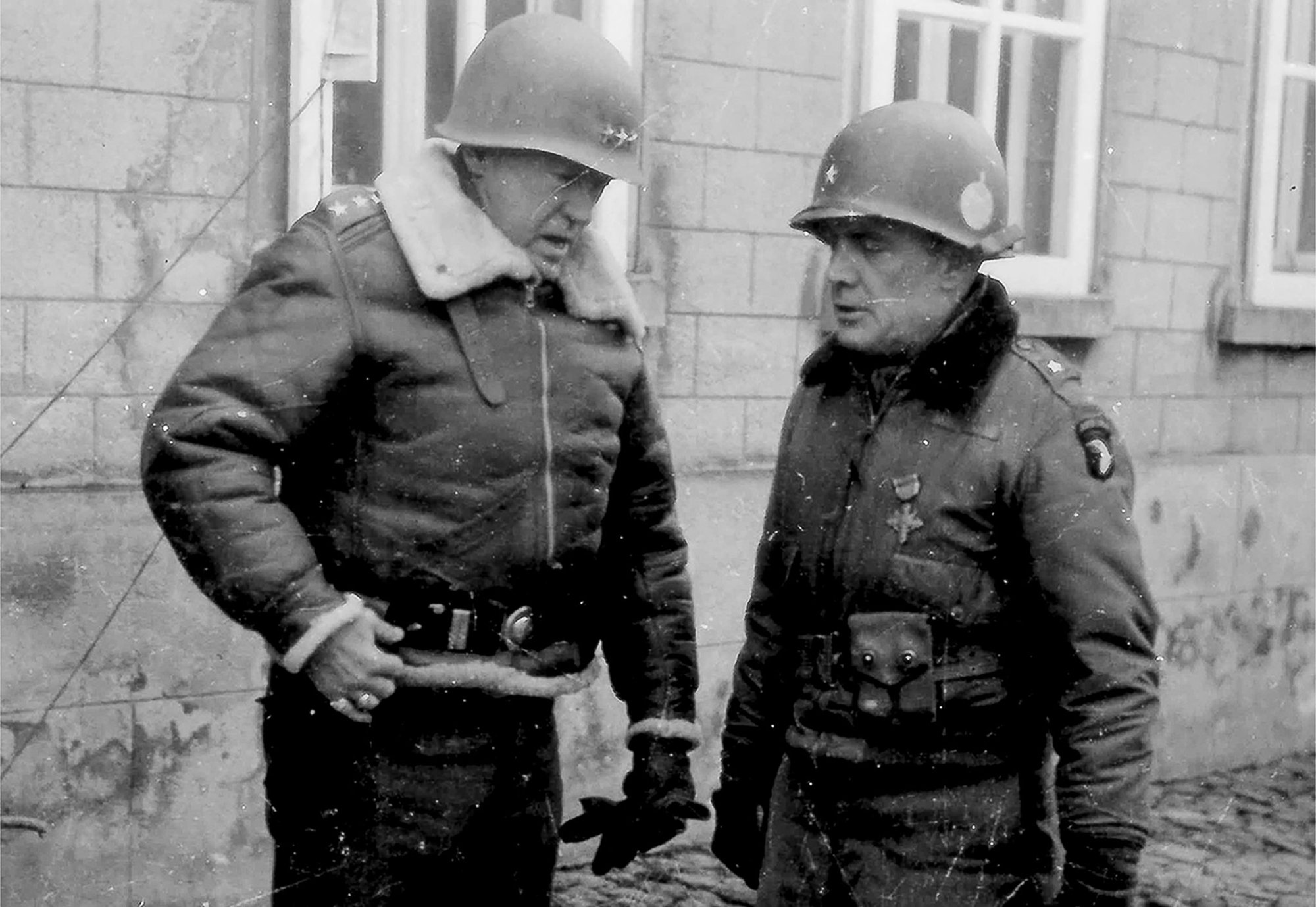 Lt. Gen. George S. Patton speaks to Brig. Gen. Anthony McAuliffe, January 1945. Patton led the Third Army in a sweep across France and an instrumental role in defeating the German counter offensive in the Ardennes. Patton commanded the Third Army from 1944 to 1945. Third Army’s unit motto “Patton’s Own – Third, Always First” is in honor of Patton. US Army photo