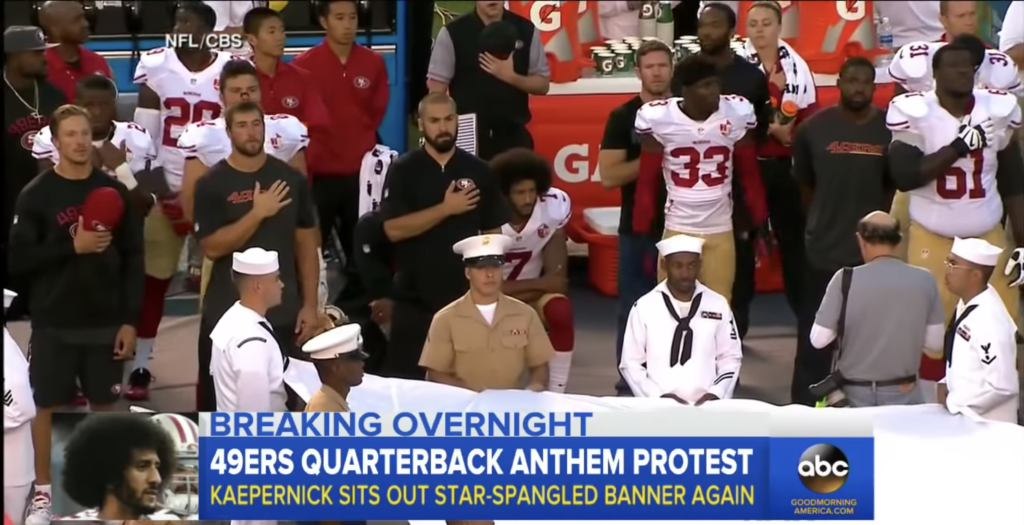 Screen grab of Colin Kaepernick kneeling for the national anthem during the 2016 NLF season.