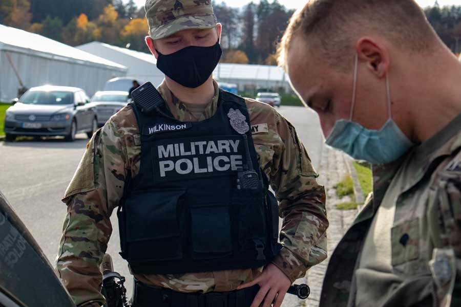 Sgt. Josh Wilkinson, a military police soldier with the 29th Military Police Company, Maryland Army National Guard, conducts a simulated shoplifting search during a Joint Multinational Readiness Center exercise rotation in Hohenfels, Germany, on Nov. 2. The soldiers are preparing to deploy to Kosovo. Photo by Sgt. Zachary M. Zippe, courtesy of the U.S. Army National Guard.