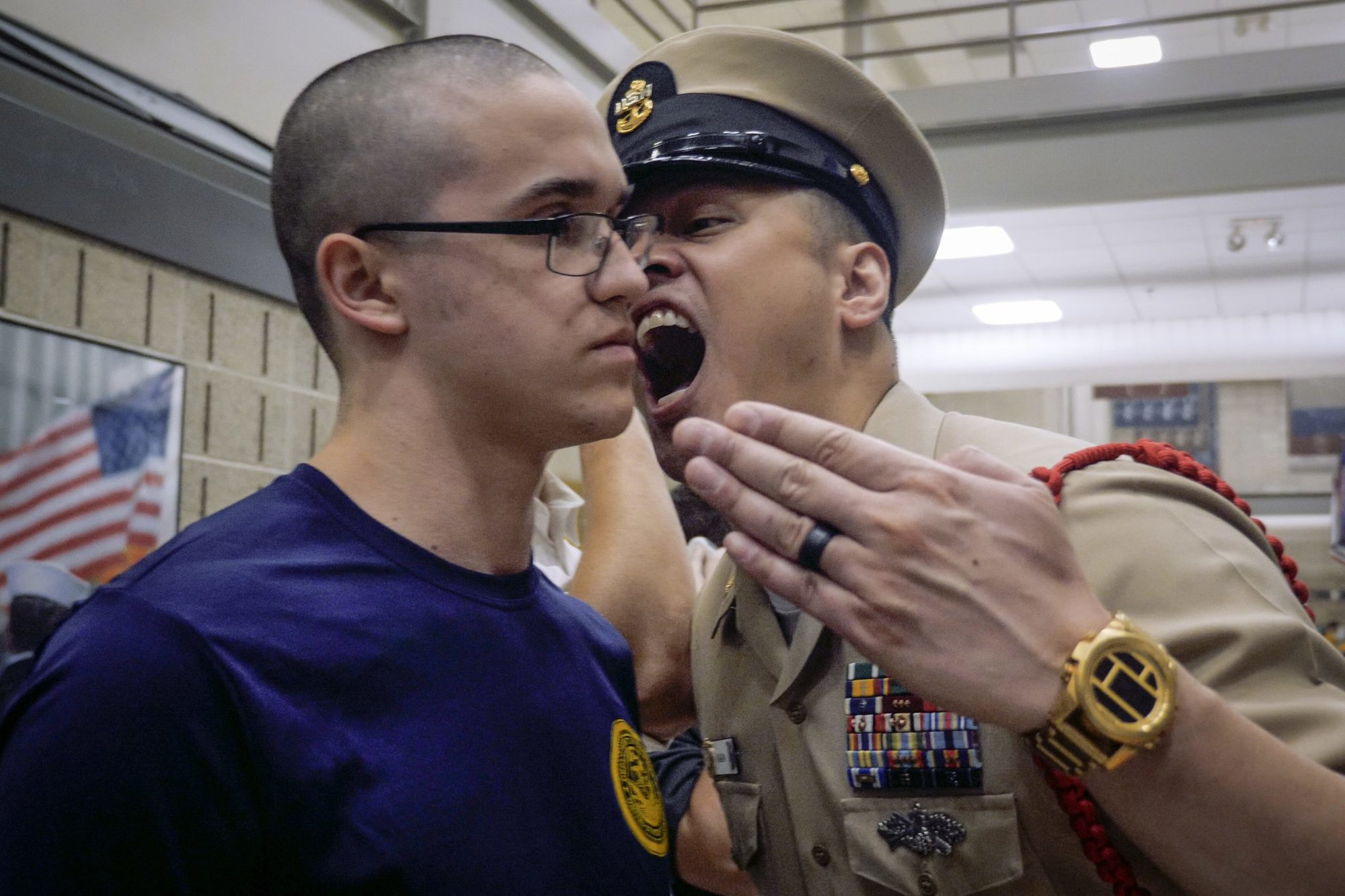 Chief Hospital Corpsman Jaime Kalaw, a recruit division commander at Recruit Training Command Great Lakes, disciplines a new recruit during “Night of Arrival” at the Navy’s only Boot Camp. US Navy photo by Austin Rooney.