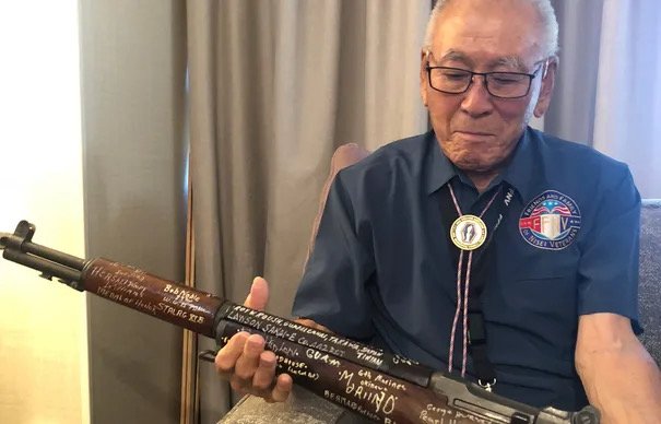 Lawson Sakai holds "The Rifle"