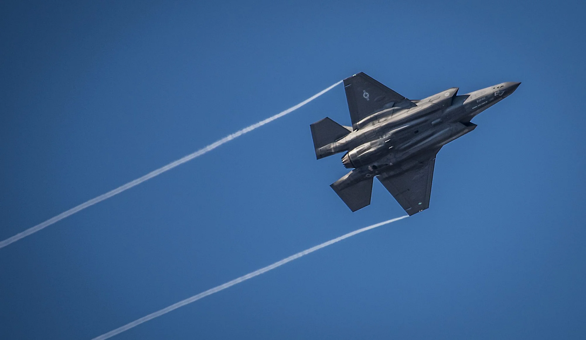 An F-35 Lightning II streaks across the sky while doing maneuvers to the Eglin Air Force Base runway. The 33rd Fighter Wing-owned aircraft is a fifth-generation fighter and used to train pilots and maintainers. US Air Force photo by Samuel King Jr.