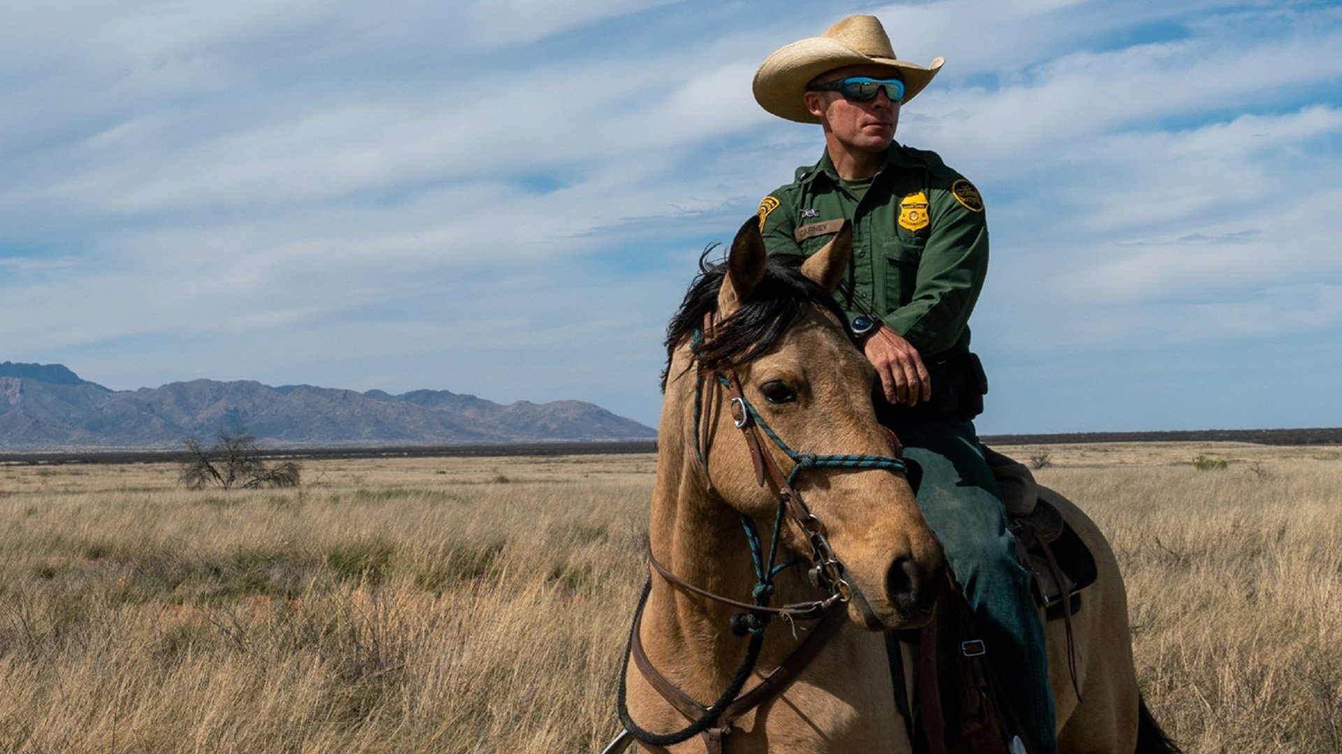 A US Border Patrol agent patrols the remote and rugged stretches of the Tucson Sector. On July 3, 2022, a Guatemalan migrant allegedly attacked and injured a fellow agent near the international boundary with Mexico. US Border Patrol photo.