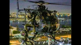 An image depicting American special operations soldiers rappelling from an MH-6 "Little Bird" in Los Angeles during their training exercise held back in 2015. Composite image by Coffee or Die Magazine. Anonymous image source.