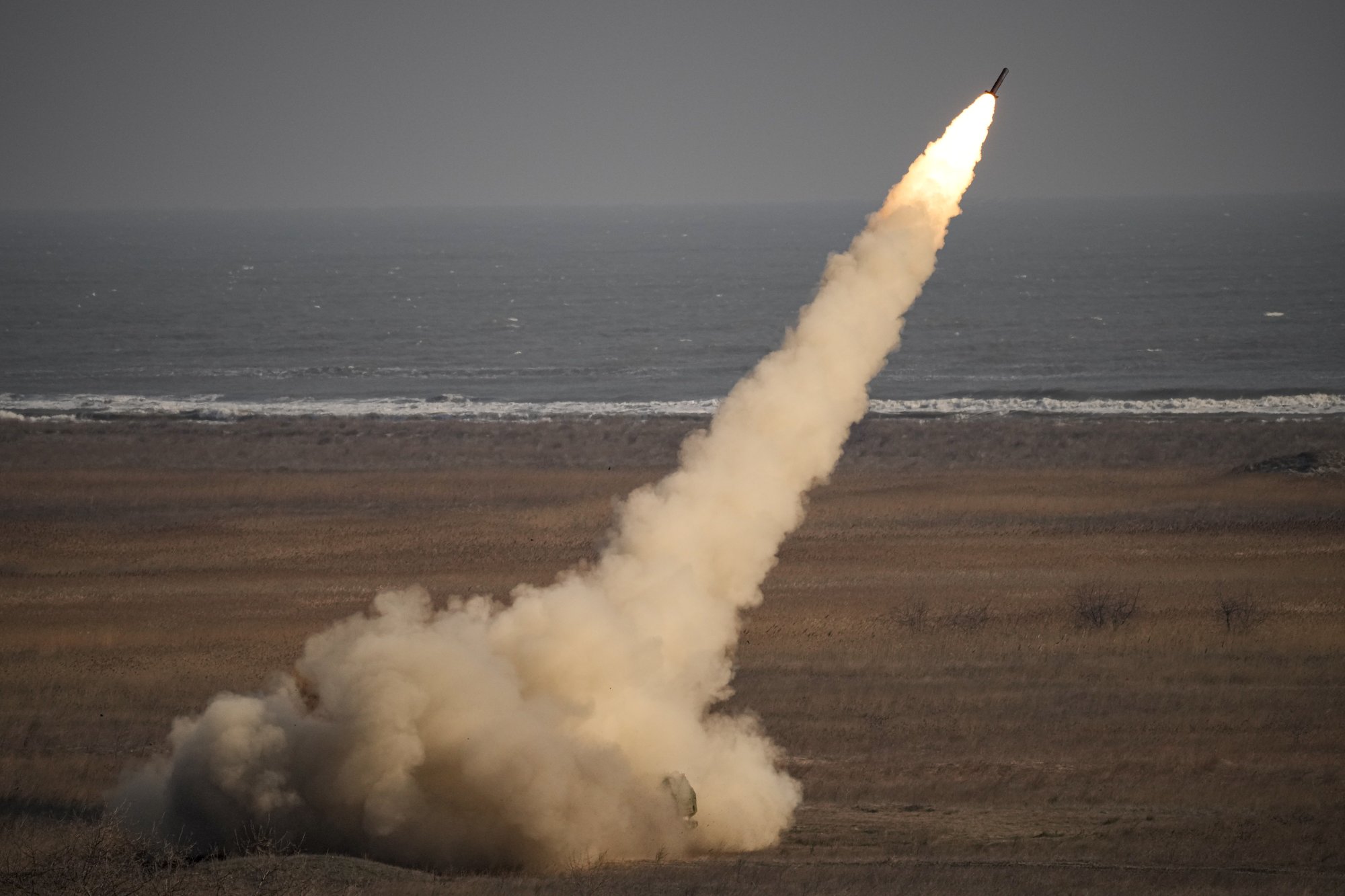 A rocket is launched from a HIMARS system during a joint French-US exercise involving HIMARS and MLRP rocket launchers at a firing range in Capu Midia, on the Black Sea shore, Romania, Thursday, Feb. 9, 2023. US and French troops that are part of a NATO battlegroup in Romania held a military exercise on Thursday to test the 30-nation alliance's eastern flank defenses, as Russia's full-scale invasion of neighboring Ukraine nears its one-year anniversary. AP photo by Andreea Alexandru.