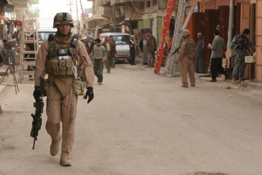 A U.S. Marine with Company K, 3rd Battalion, 5th Marines (3/5), Regimental Combat Team 1 (RCT-1) patrols the Andaloos district of Al Fallujah, Iraq on Jan. 29, 2008. USMC photo/Lance Cpl. Grant T. Walker via DVIDs.