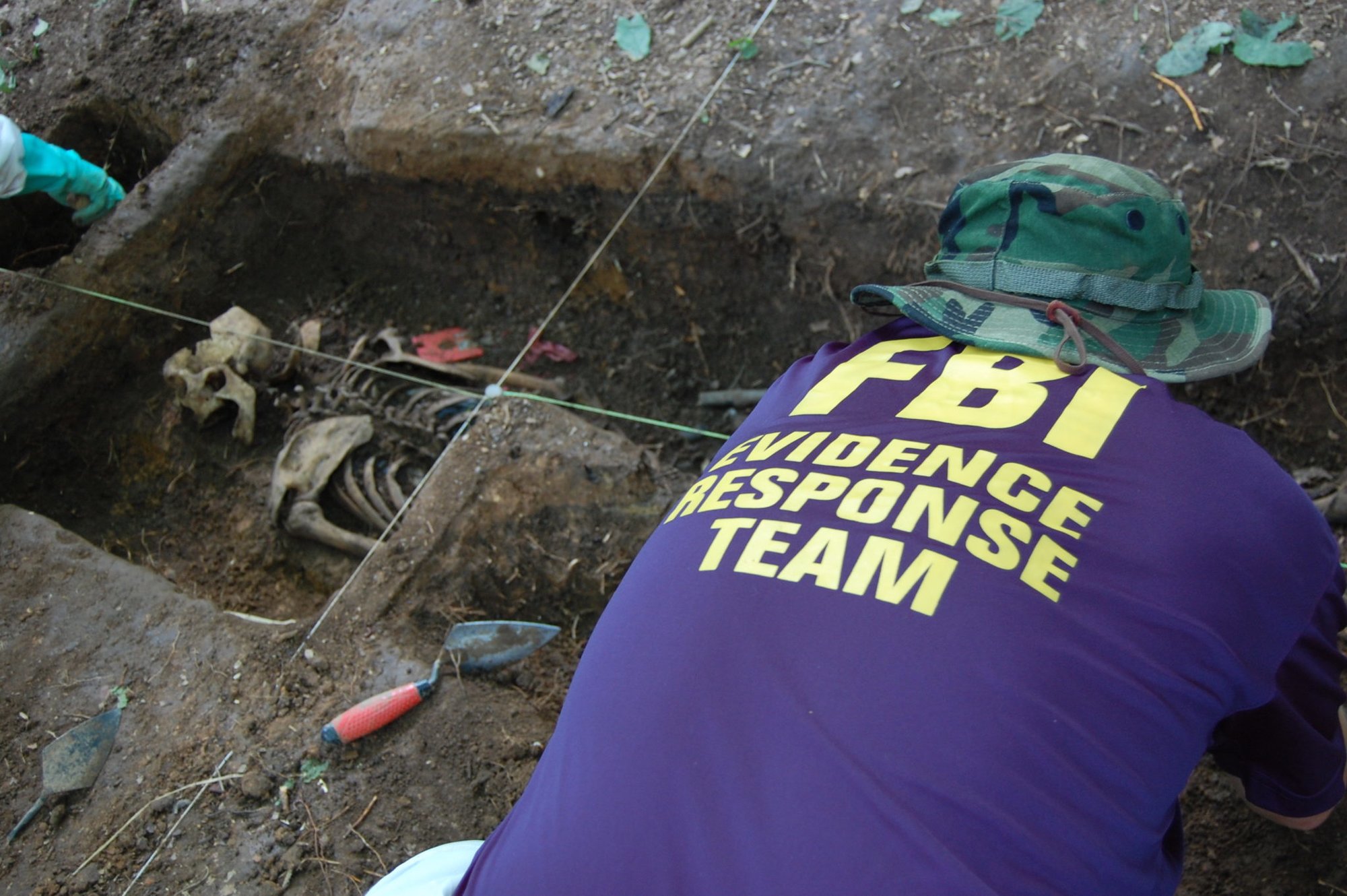 A student excavates a shallow grave at the Body Farm in Knoxville, Tennessee. Photo courtesy of FBI.gov