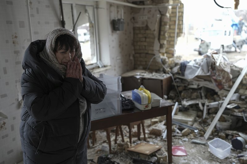 Halina Panasian, 69, reacts inside her destroyed house after a Russian rocket attack in Hlevakha, Kyiv region, Ukraine, Thursday, Jan. 26, 2023. AP photo by Roman Hrytsyna.