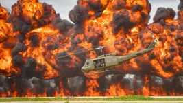 A Bell UH-1 Iroquois Helicopter or “Huey” takes off amidst an explosion during a reenactment of a Vietnam era combat search and rescue mission. The demonstration was performed by Cavanaugh Flight Museum at Joe Foss Field, South Dakota, August 18, 2019. Photo by US Air National Guard Staff Sgt. Jorrie Har.
