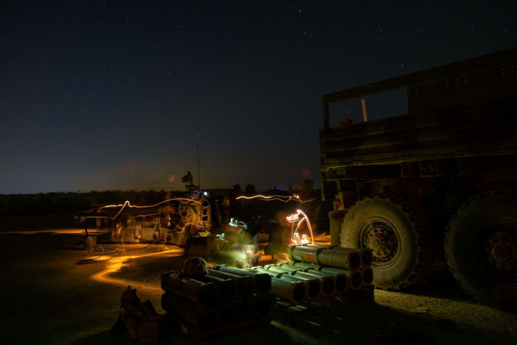 Beneath a star-studded Iraqi sky, members of the 2-8 Artillery Battalion’s Charlie Battery readies their gun, affectionately dubbed Catastrophe.