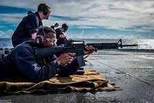 Aviation Boatswain’s Mate (Fuels) 2nd Class Torien Collins fires an M16 rifle during a small arms qualification on the flight deck of the amphibious transport dock ship USS Green Bay (LPD 20), Aug. 11, 2016. US Navy photo by Mass Communication Specialist 3rd Class Patrick Dionne.
