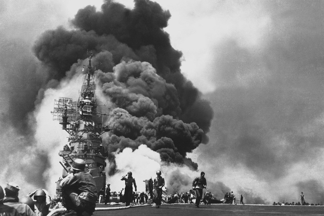 The U.S. aircraft carrier Bunker Hill burns after being struck by two Japanese kamikaze aircraft, May 11, 1945, in the waters between Okinawa and Kyushu, Japan. Photo courtesy of the National Archives.