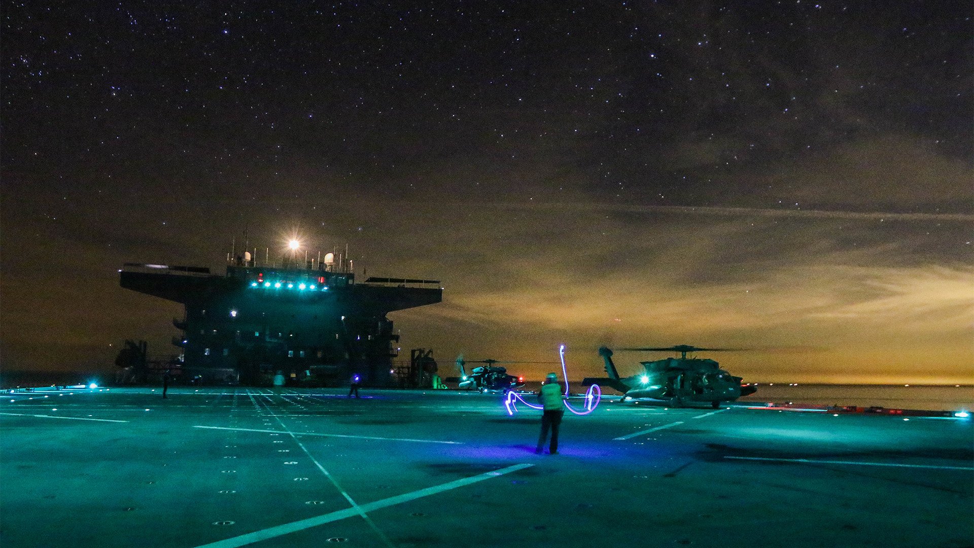 US Army soldiers from the 1-108th Assault Helicopter Battalion, Kansas Army National Guard, conduct day and night deck landing qualifications with UH-60 Black Hawk helicopters on board the US Navy's expeditionary sea base Lewis B. Puller in the Persian Gulf on March 29, 2019. US Central Command claims an Iranian gunboat tried to blind Lewis B. Puller's bridge with a spotlight on Dec. 5, 2022, in the Strait of Hormuz. US Army National Guard photo by Sgt. Emily Finn.