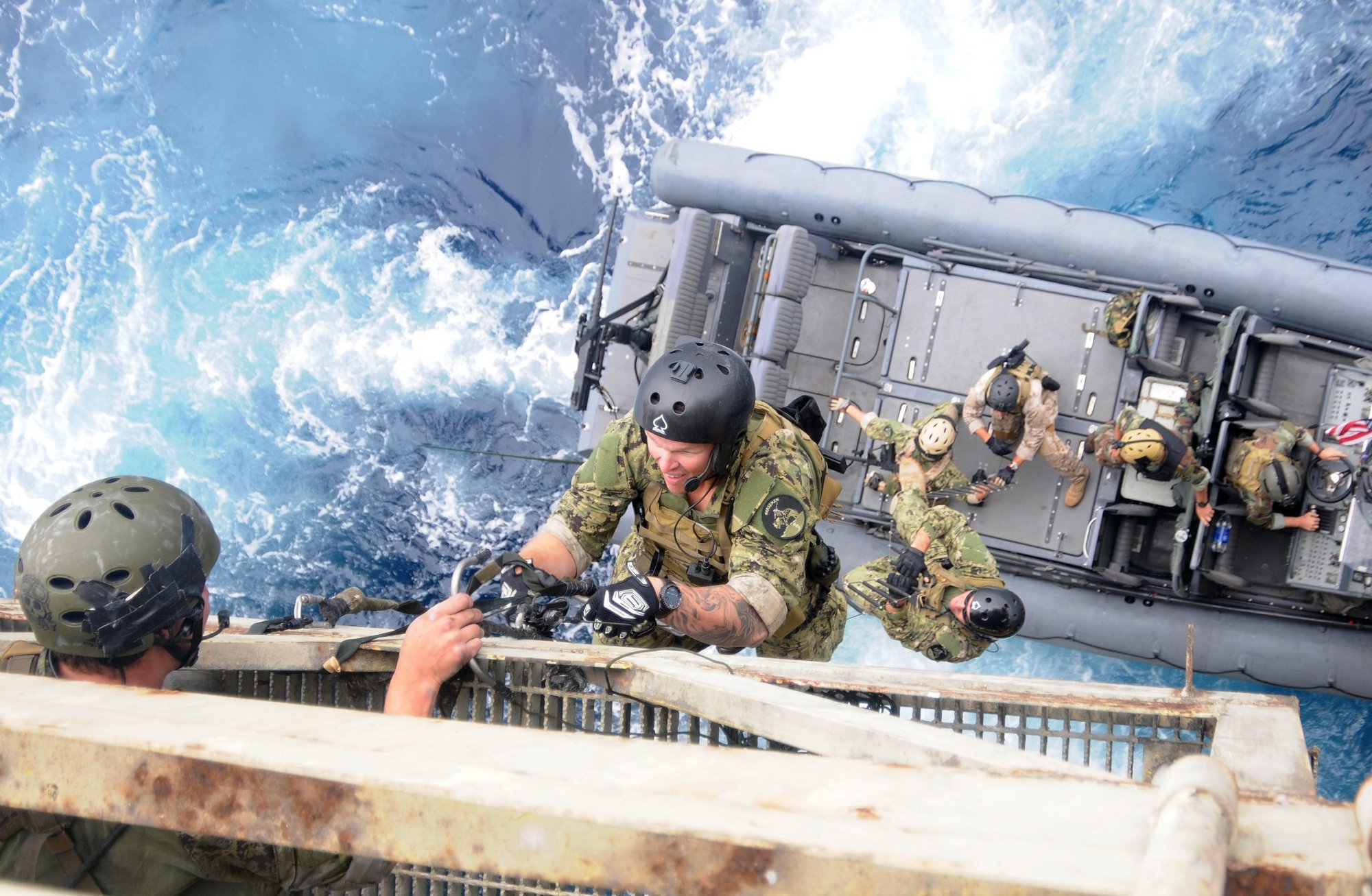 U.S. Navy SEALs train with Special Boat Team 12 on the proper techniques of how to board gas and oil platforms during the SEALs gas and oil platform training cycle. SEALs conduct these evolutions to hone their various maritime operations skills.
