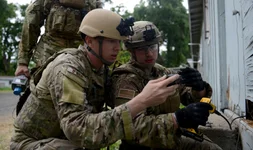Then-Staff Sgt. David Dezwaan (left), and Airman 1st Class Alex Nona at Clear Lake, California in 2016. The EOD technicians participated in Operation: Half-Life, an exercise designed to evaluate a synchronized, multi-agency response to a crisis-situation. (U.S. Air Force photo by Senior Airman Bobby Cummings)