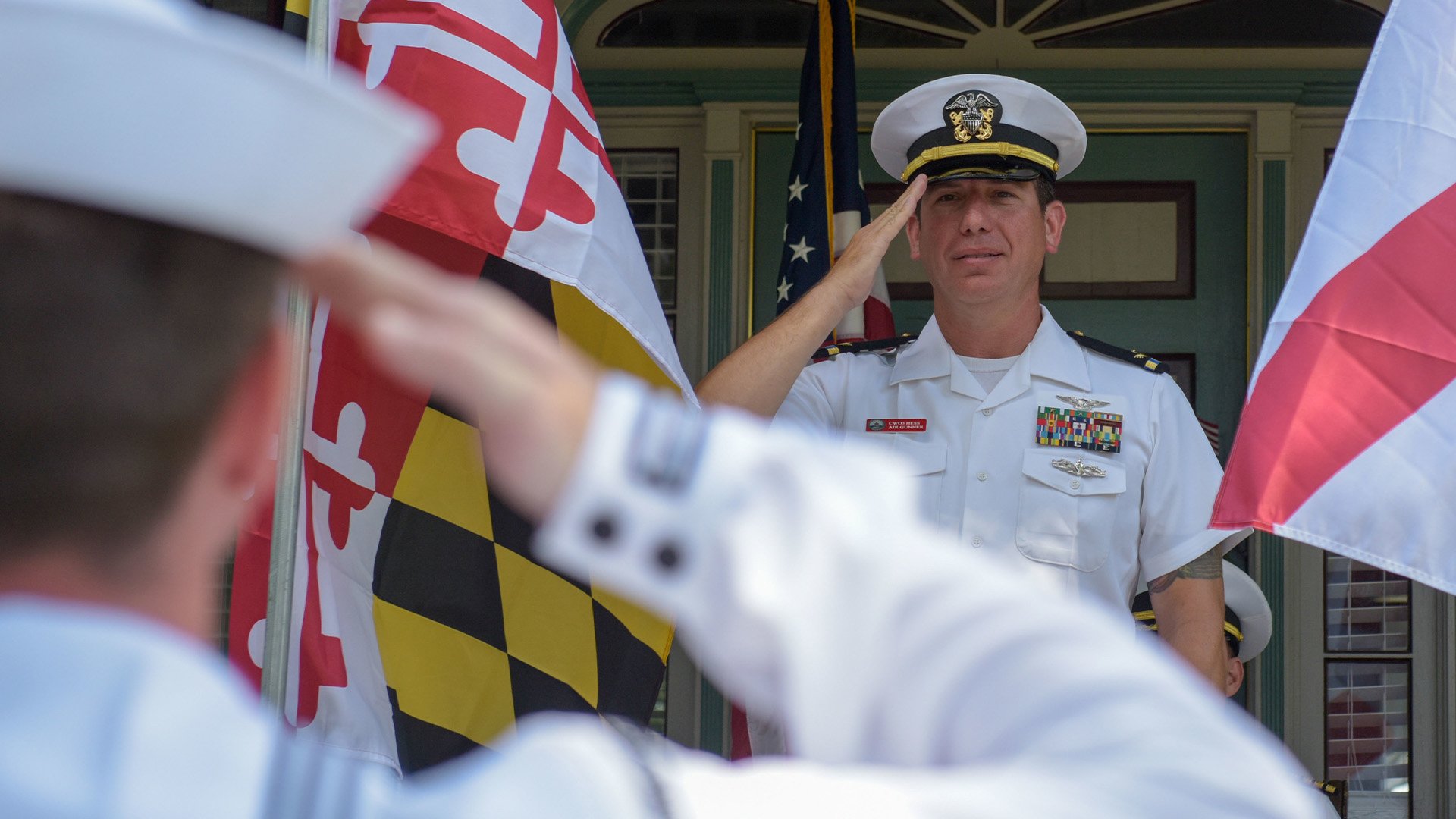 US Navy Chief Warrant Officer 3 Nicholas Hess, assigned to the aircraft carrier John C. Stennis, renders a salute at his retirement ceremony, after 23 years of service, in Smithfield, Virginia, July 1, 2022. A glut in unprocessed DD-214s has led the Navy to issue DD-214 discharge forms that lack a sailor's signature, but the sea service wants government agencies, veterans' organizations, and employers to know that they're still valid separation documents. US Navy photo by Mass Communication Specialist 3rd Class Riley Gasdia.