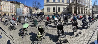 A memorial of 109 empty baby carriages in Rynok Square in Lviv. There’s one each for every child known to have died in the war. Photo by Marty Skovlund Jr./Coffee Or Die Magazine.