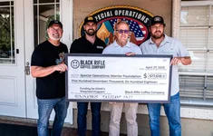 Black Rifle Coffee Company's Tim Pachasa and Mat Best represent BRCC during the check presentation to the Special Operations Warrior Foundation. Retired Maj. Gen. Clay Hutmacher is the president and CEO of SOWF, and Cole Hauser serves on the board of directors. Photo by Benjamin Pennington/Coffee or Die.