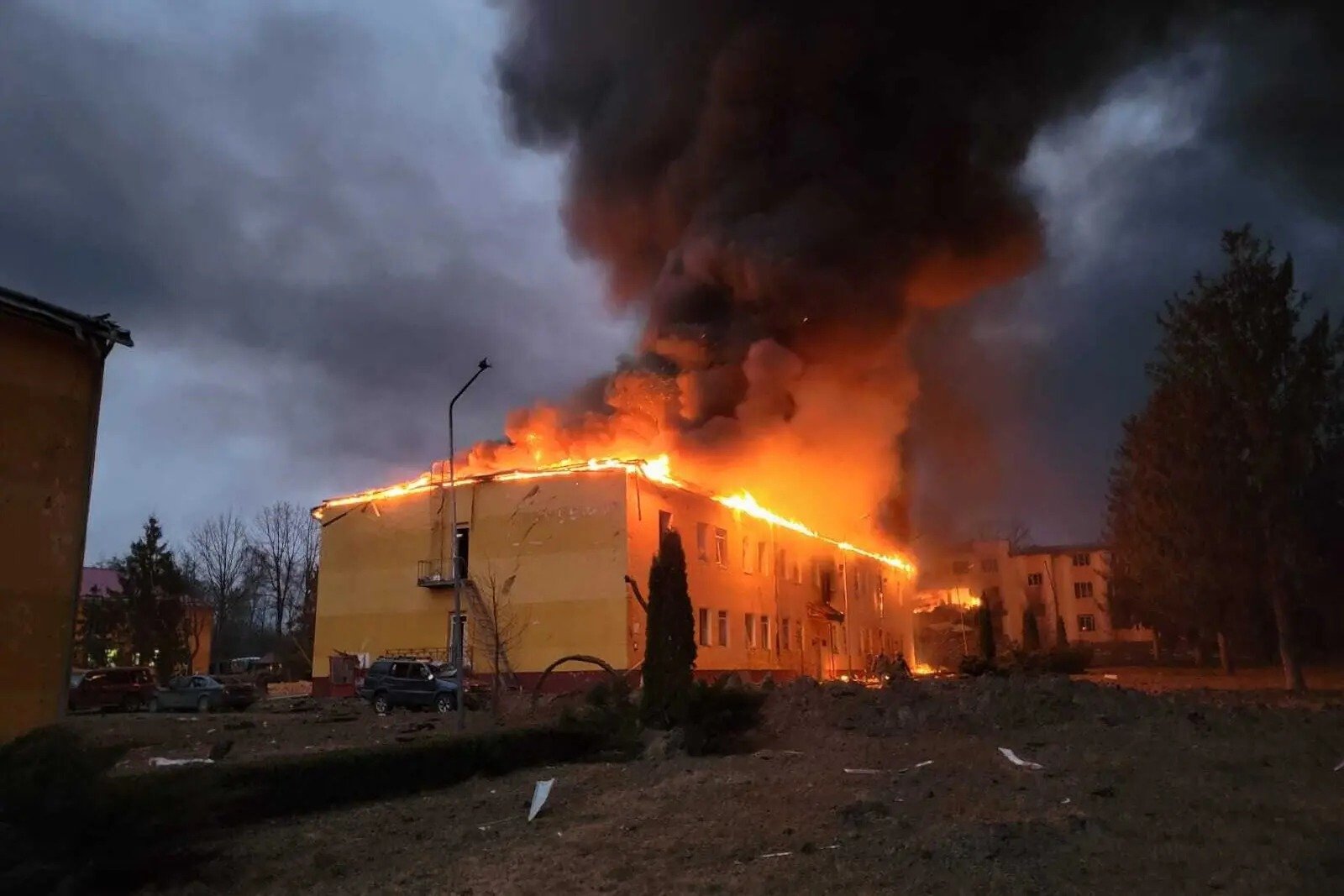 A hostel building, part of a larger training facility,burns.
