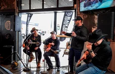 More than 2,500 people from the community came out to support SEAA at the Clarksville, Tennessee, BRCC outpost. The fundraiser was hosted by country musician Tim Montana, left, and BRCC co-founder Mat Best, second from right. Photo courtesy of Black Rifle Coffee Company.