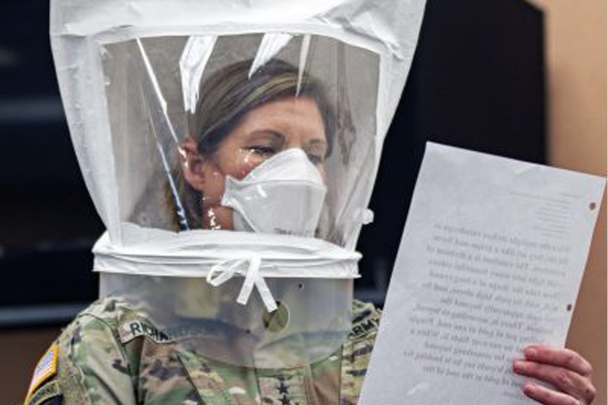 Lt. Gen. Laura Richardson, commander of U.S. Army North, goes through the safety precautions before entering the patient ward of the Edison Field Medical Site in Edison, N.J., April 13, 2020. While the peak of her command's COVID-19 response has passed, Richardson recently said it remains poised to step up and help should the need arise. (Sgt. ShaTyra Reed)