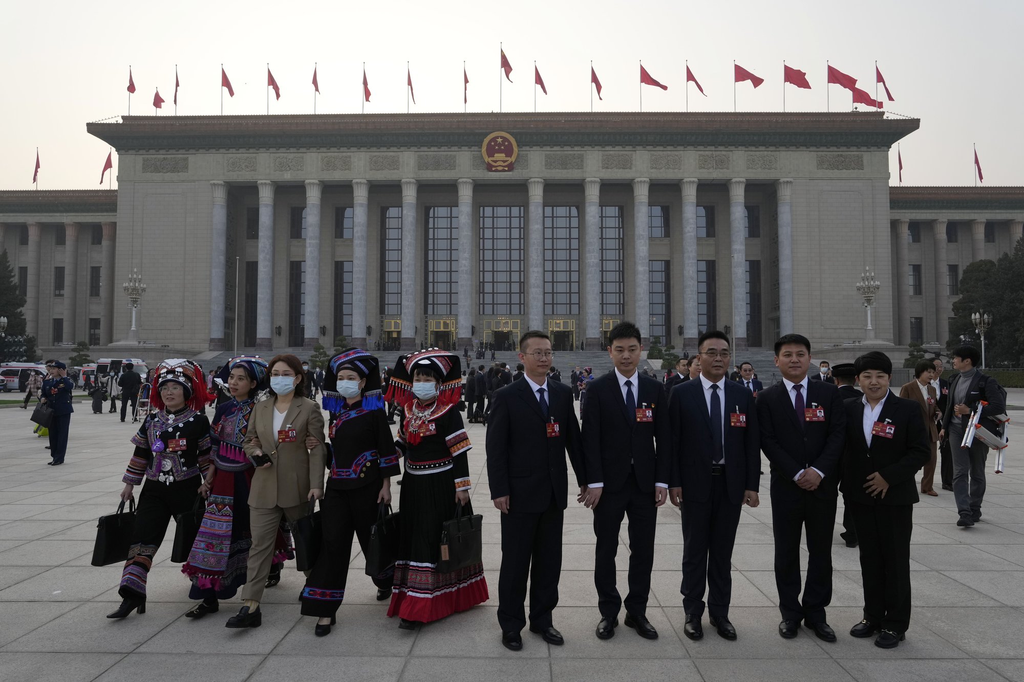 Delegates pose for a group photo after a session of China's National People's Congress (NPC) at the Great Hall of the People in Beijing, Tuesday, March 7, 2023. (AP Photo/Ng Han Guan)