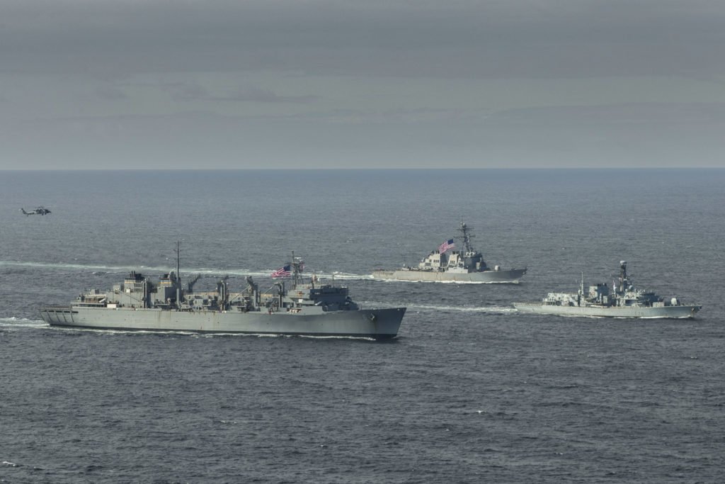 The fast combat support ship USNS Supply (T-AOE 6), left, the Royal Navy Type-23 Duke-class frigate HMS Kent (F78) and the Arleigh Burke-class guided-missile destroyer USS Porter (DDG 78) conduct joint operations to ensure maritime security in the Arctic Ocean, May 5, 2020. U.S. Navy photo courtesy of the Royal Navy by Royal Navy Photographer Dan Rosenbaum/Released.