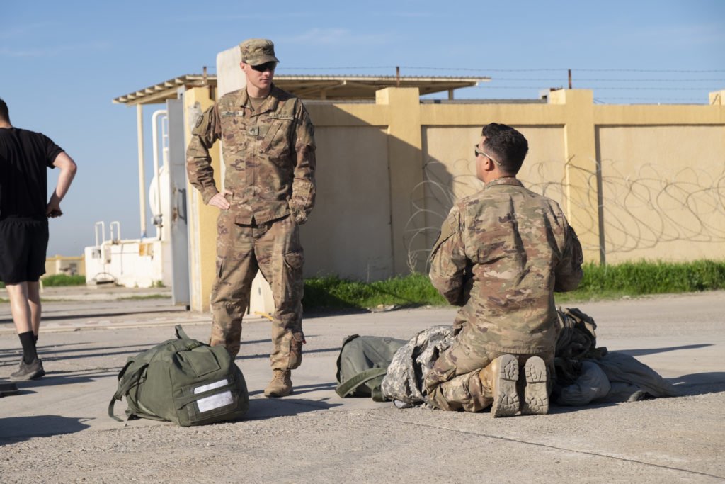 SSG Jackson and Cpl Rivera prepare their personal belongings for a customs check continue to prepare for their departure from K1. Photo by Kevin Knodell/Coffee or Die.