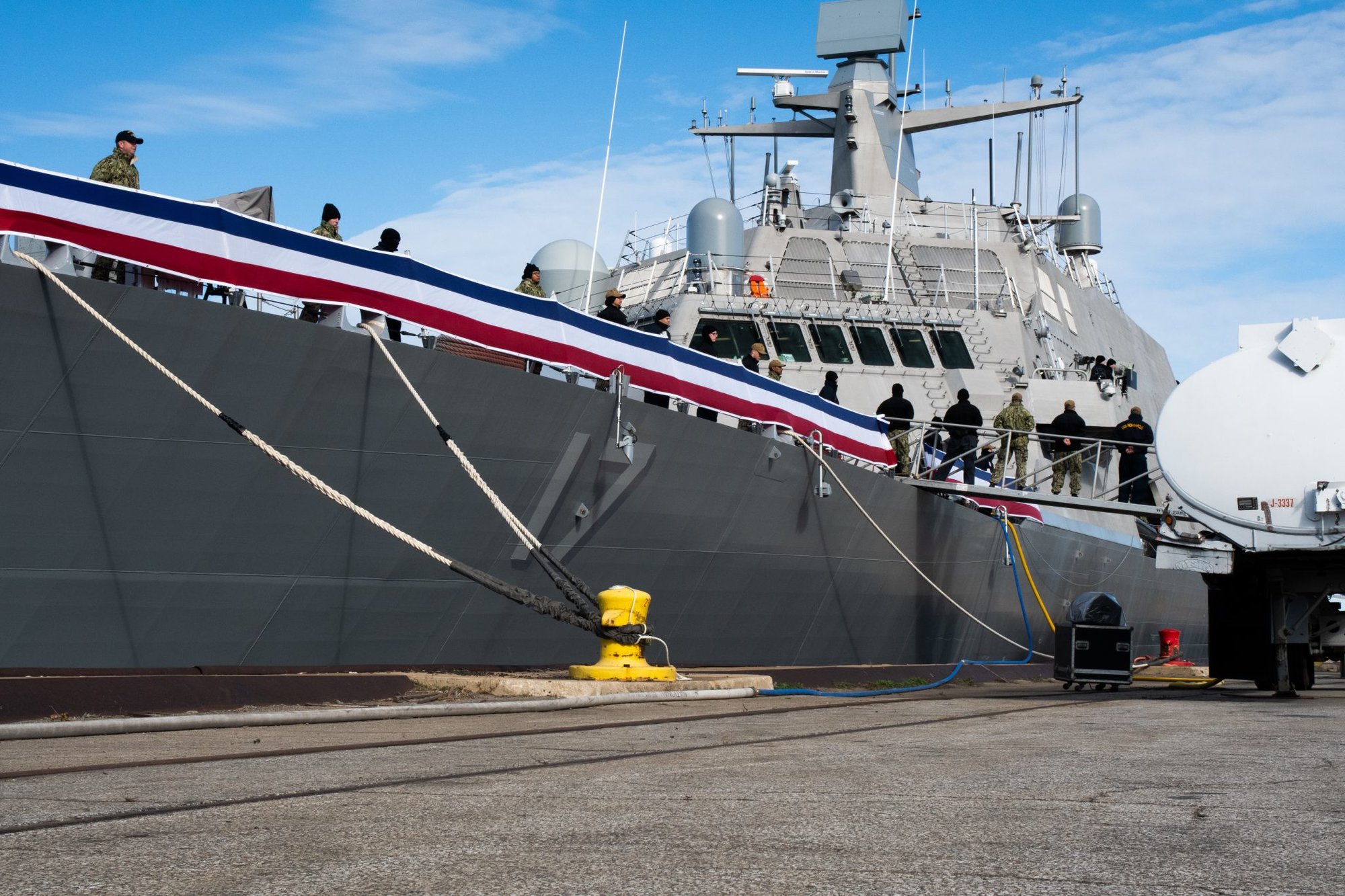 191023-N-UZ091-0011 BURNS HARBOR, Ind. (Oct. 23, 2019) The crew of the future USS Indianapolis (LCS 17) man the rails during a pre-commissioning rehearsal. LCS 17 is the 19th littoral combat ship to enter the fleet and the ninth of the Freedom-variant. It will be the fourth ship named for Indianapolis, Indiana’s capital city. (U.S. Navy Photo by Mass Communication Specialist 3rd Class Timothy Haggerty)