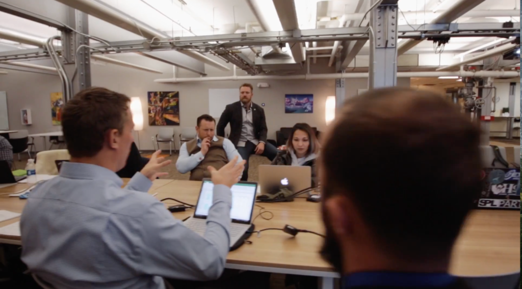 This screen grab from a Warrior Rising video shows a gathering of veterans discussing their business ideas. 