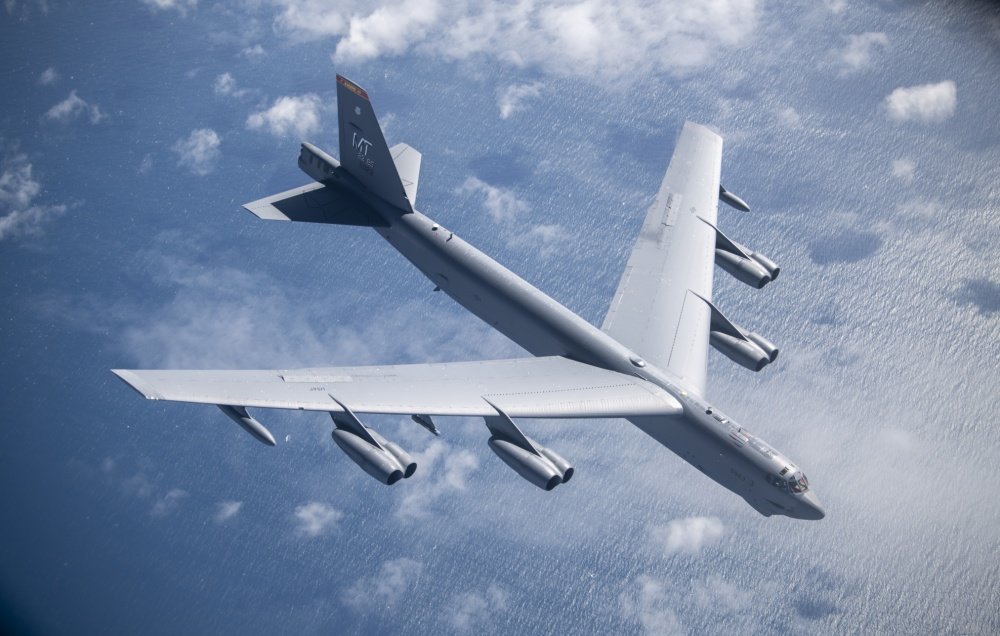 A U.S. Air Force B-52 Stratofortress from the 5th Bomb Wing, Minot Air Force Base, North Dakota, breaks away from a KC-135 Stratotanker from the 100th Air Refueling Wing, RAF Mildenhall, England, after receiving fuel during a strategic bomber mission off the northern Norwegian coast, June 3, 2020. U.S. Air Force photo by Tech. Sgt. Emerson Nuñez.