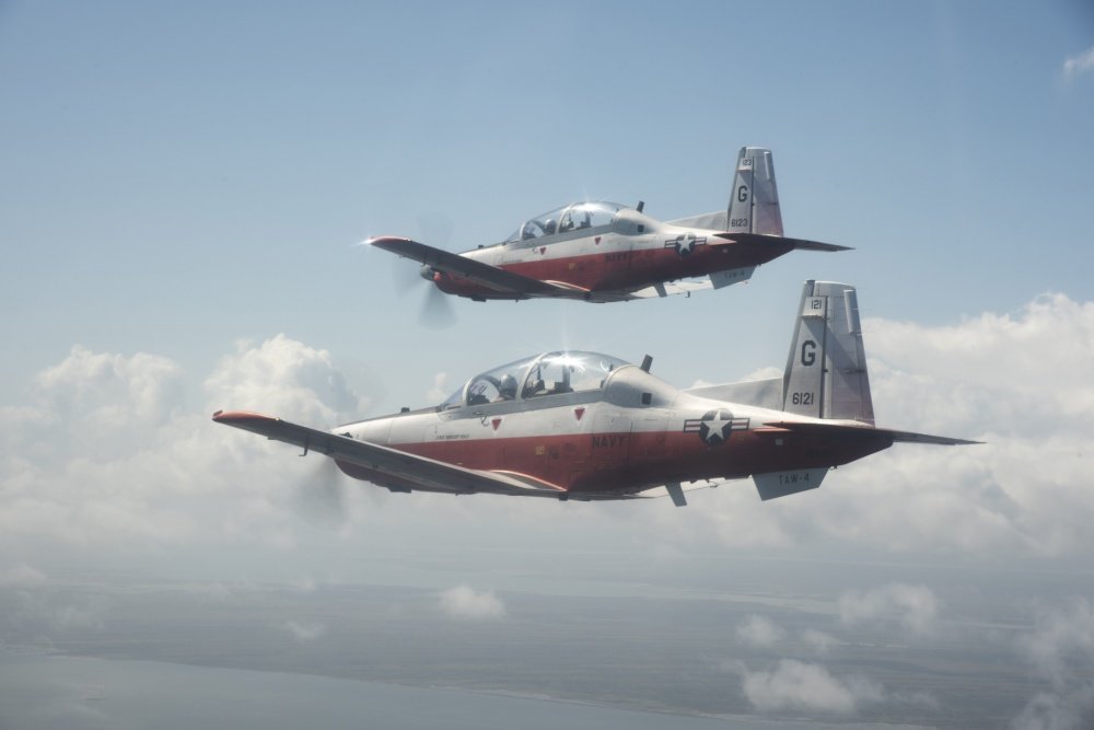 CORPUS CHRISTI, Texas (Oct. 23, 2020) Marine 1st Lt. John Kenyon, top, and Marine 1st Lt. Matthew Lorber, student naval aviators assigned to the “Boomers” of Training Squadron (VT) 27, conduct a formation flight in T-6B Texan II aircraft above the Corpus Christi area, Oct. 23. U.S. Navy photo by Lt. Michelle Tucker/Released via DVIDS.
