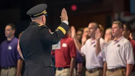 Lt. Gen. Timothy J. Kadavy, director of the Army National Guard, administers the oath of enlistment to 60 young men and women who joined the ranks of the Army National Guard, during a future soldier swearing-in ceremony July 18, 2018, at Joint Base Myer-Henderson Hall, Virginia. US Army photo by Sgt. Nicholas T. Holmes.