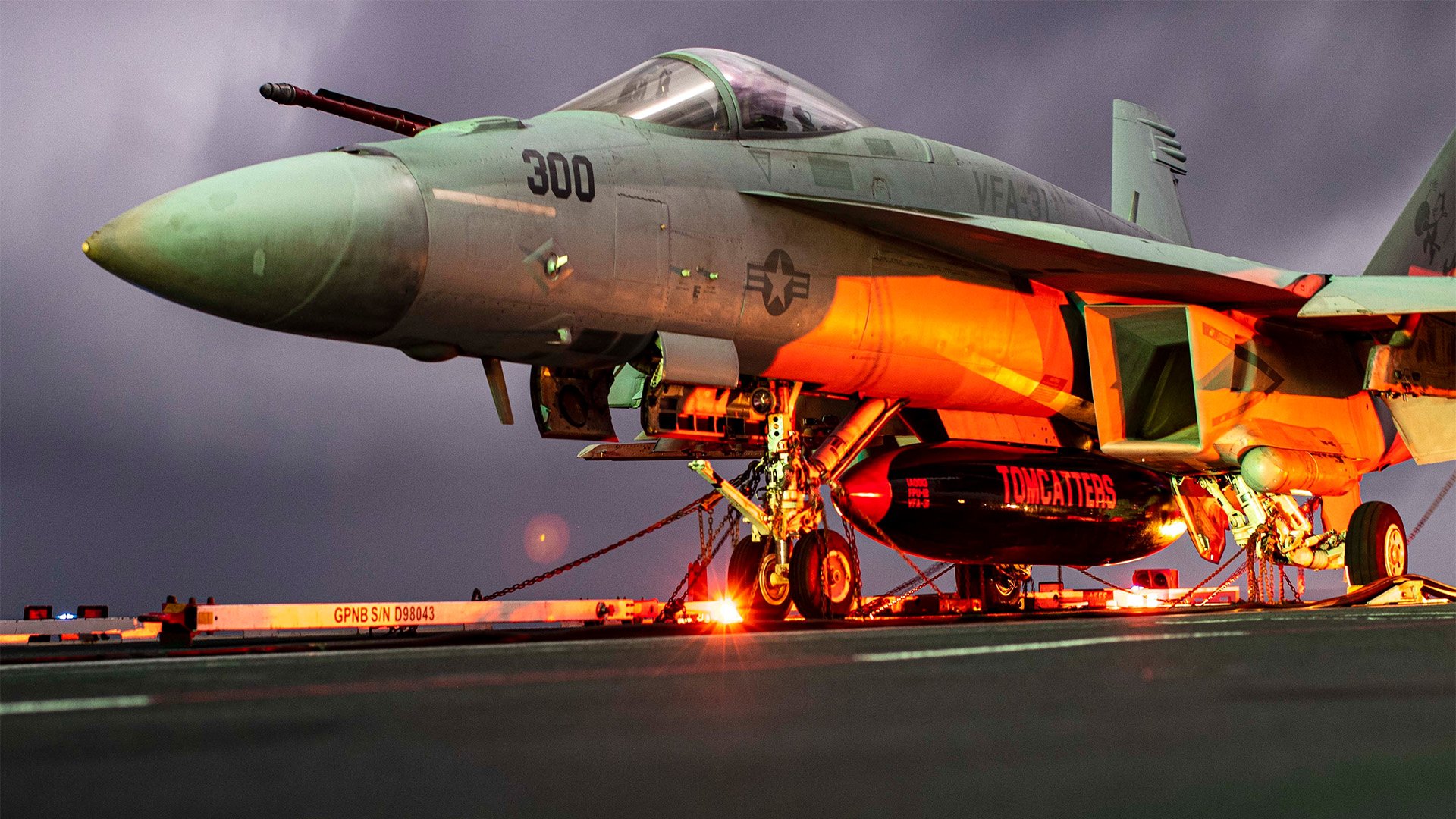 An F/A-18E Super Hornet from the "Tomcatters" of Strike Fighter Squadron 31 is chocked and chained on the aircraft carrier Gerald R. Ford’s flight deck, Nov. 7, 2022, while the flattop sailed the Atlantic Ocean. The Gerald R. Ford Carrier Strike Group is one of five NATO carriers patrolling European waters in November. US Navy photo by Mass Communication Specialist Seaman Apprentice Daniel Perez.